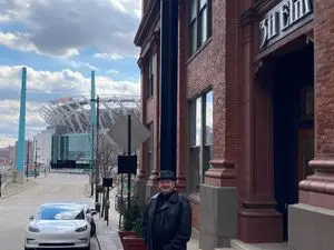 a man standing on a sidewalk